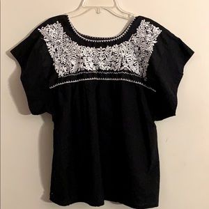 Embroidered black blouse with white embroidery